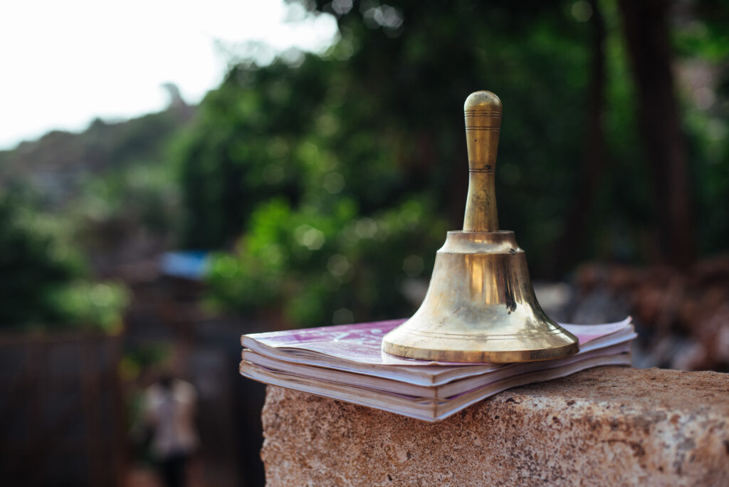 yellow school bell outside the school