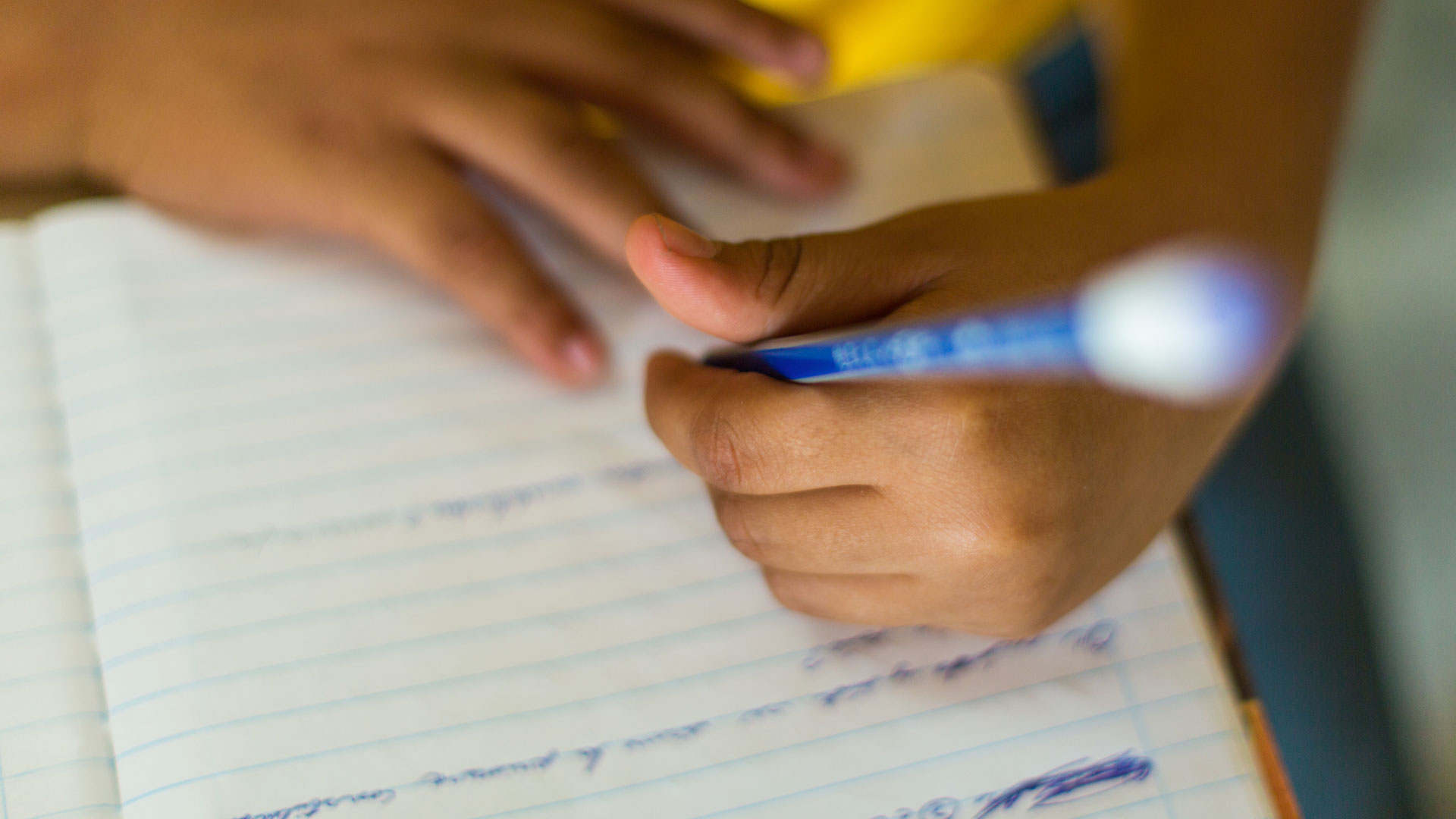 Student writing in the DR