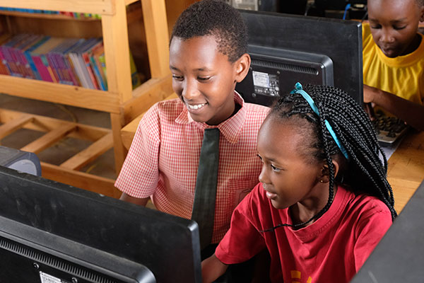 Students on a computer at Agape School, Rwanda